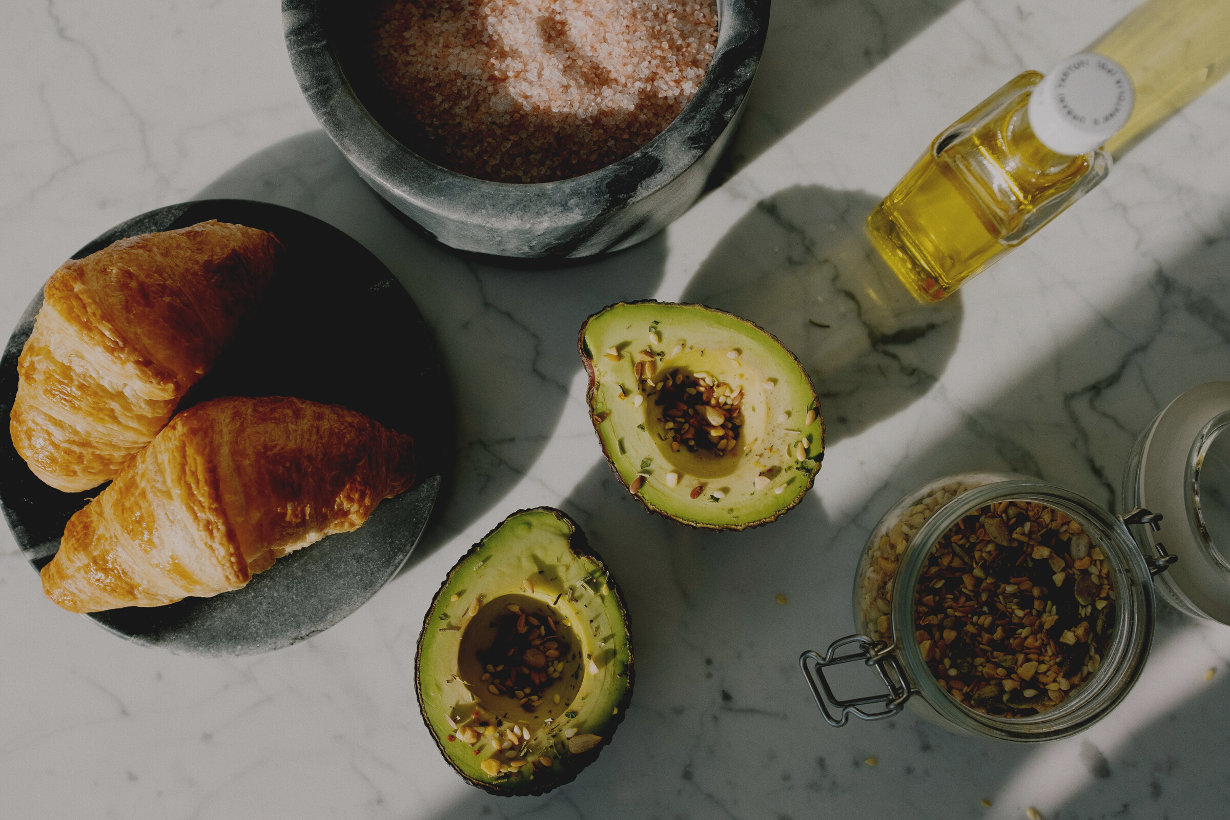 Fresh food and ingredients for healthy breakfast on marble desk